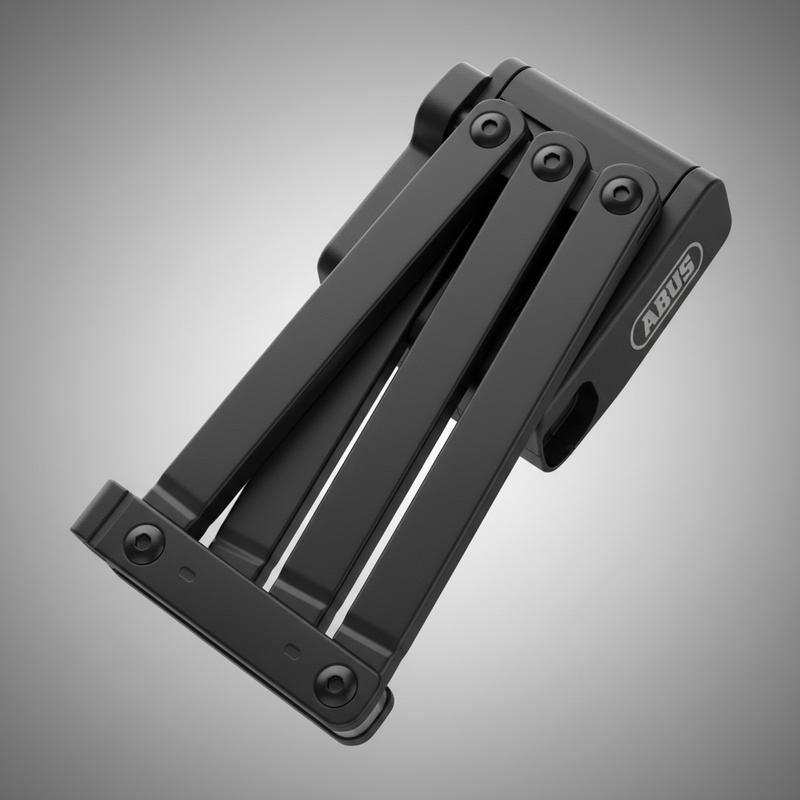 Antivol pliable Abus Bordo Granit XPlus 6500 partiellement déplié sur fond gris neutre, révélant ses articulations robustes et son revêtement noir